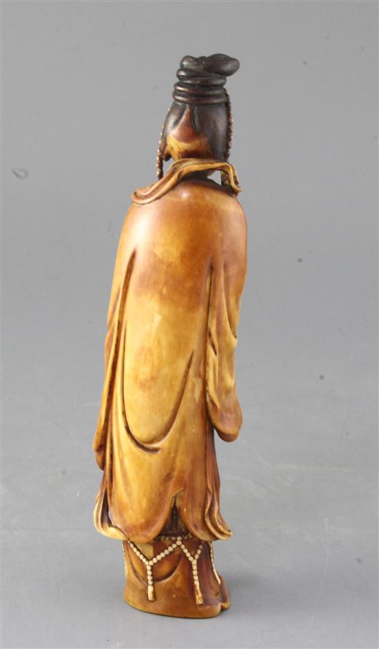A Chinese Ming dynasty ivory figure of Guanyin, 17th century, 23cm high
